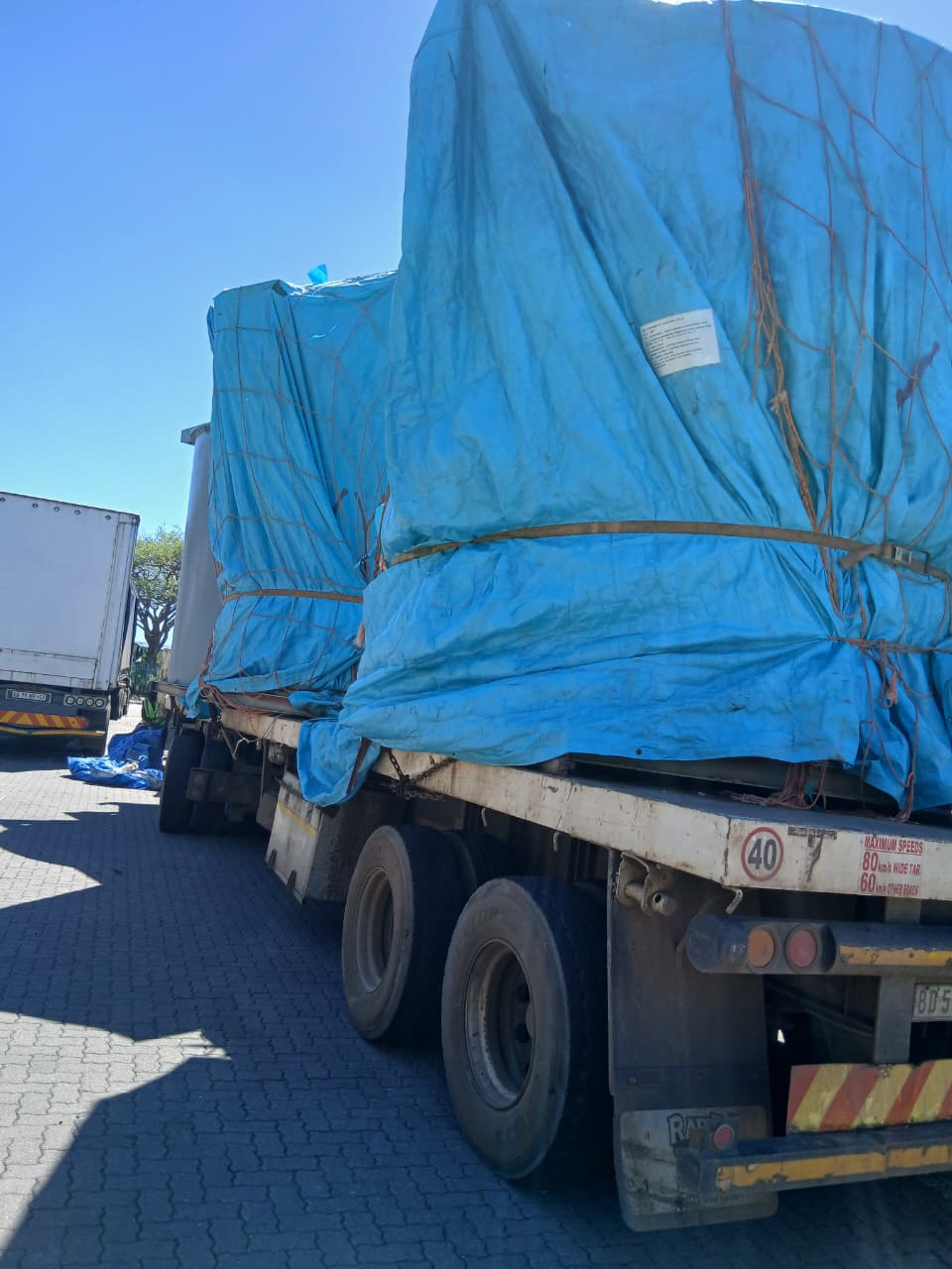 Tarped Flatbed Cargo Transport